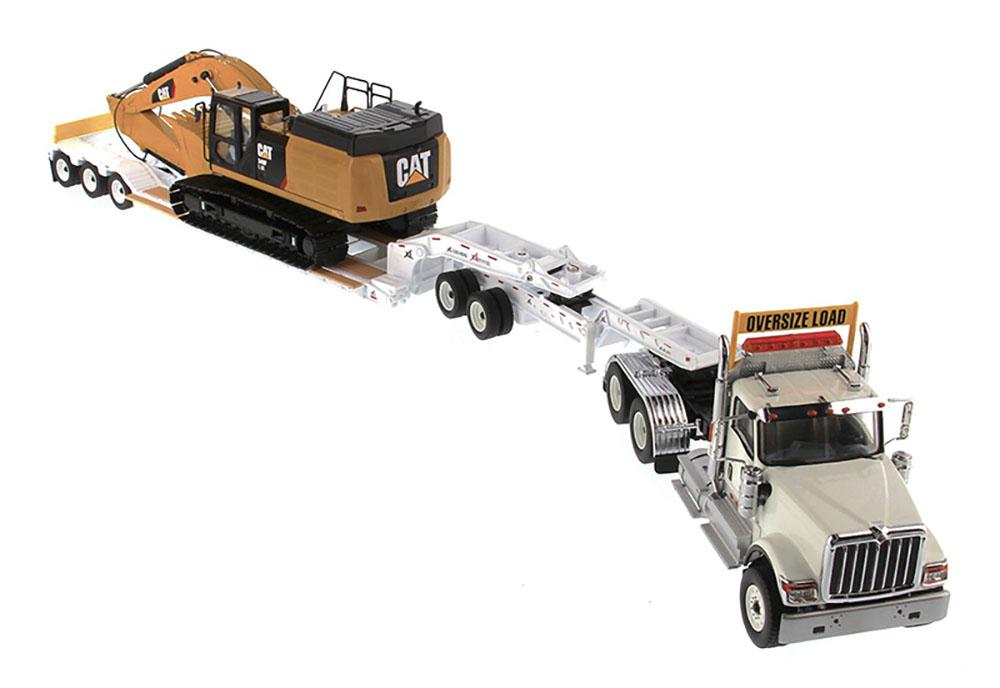 1:50 International HX520 Tandem Tractor + XL 120 Trailer outriggers, White w/ Cat®349F L XE Hydraulic Excavator loaded including both rear boosters and front jeep